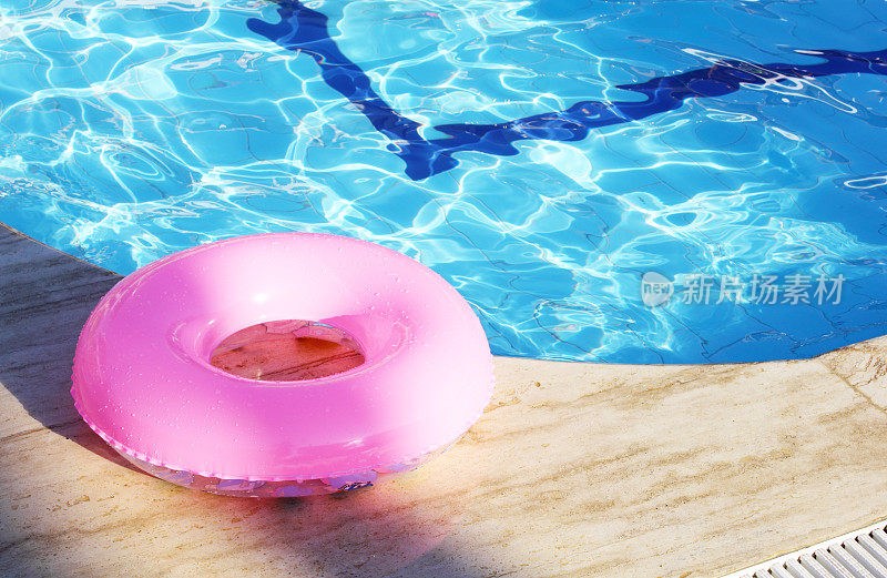 Floating ring  on edge of swimming pool